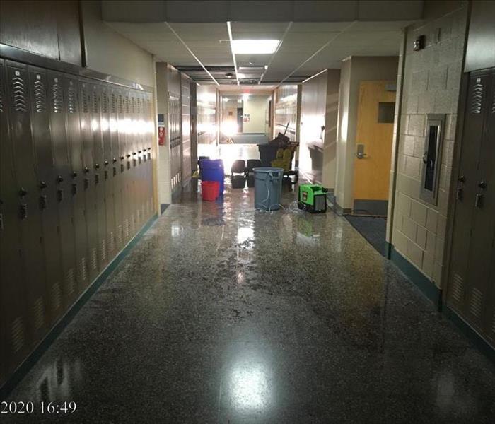 Water on the floor in the hallway of the school