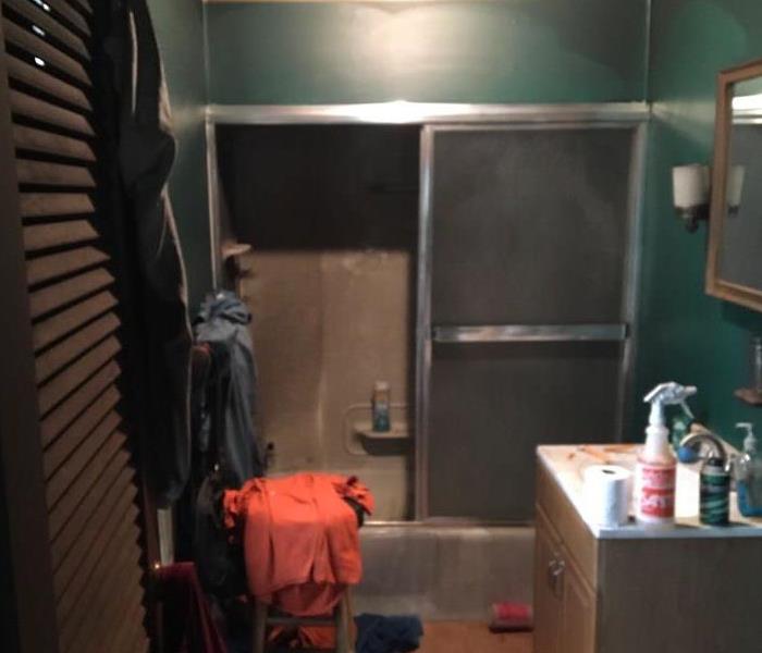 Bathroom ruined by smoke damage from house fire