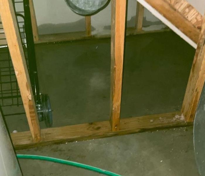 basement concrete has standing water from snowstorm freezing pipes